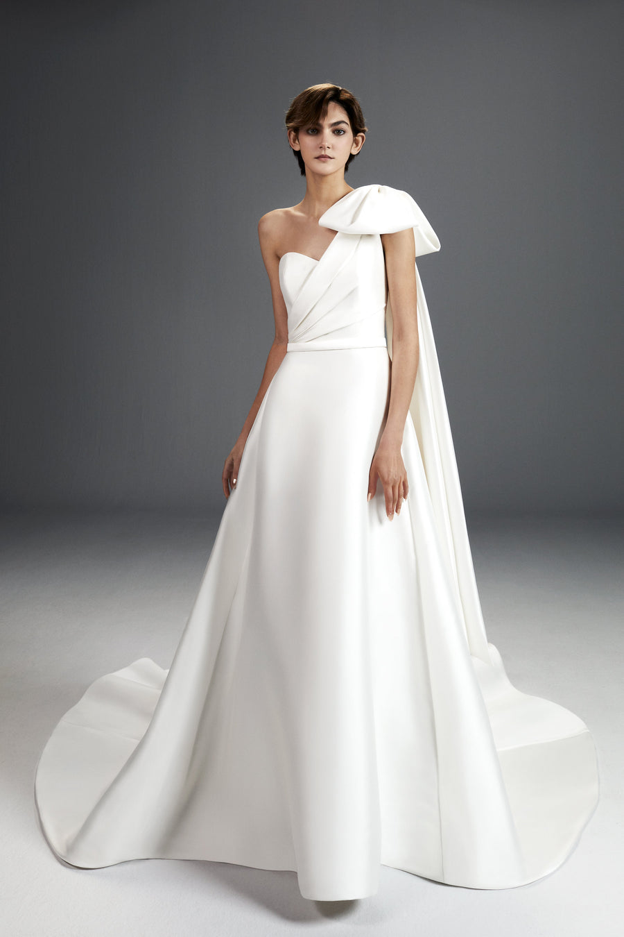 Viktor & Rolf Mariage Bridalwear Collection, Dreamy shoulder bow gown with elegant draping and modern design.
