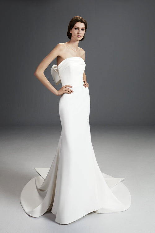 Viktor & Rolf Mariage Bridalwear Collection, Sculpted Bow Gown, elegant white strapless design with a dramatic bow accent.