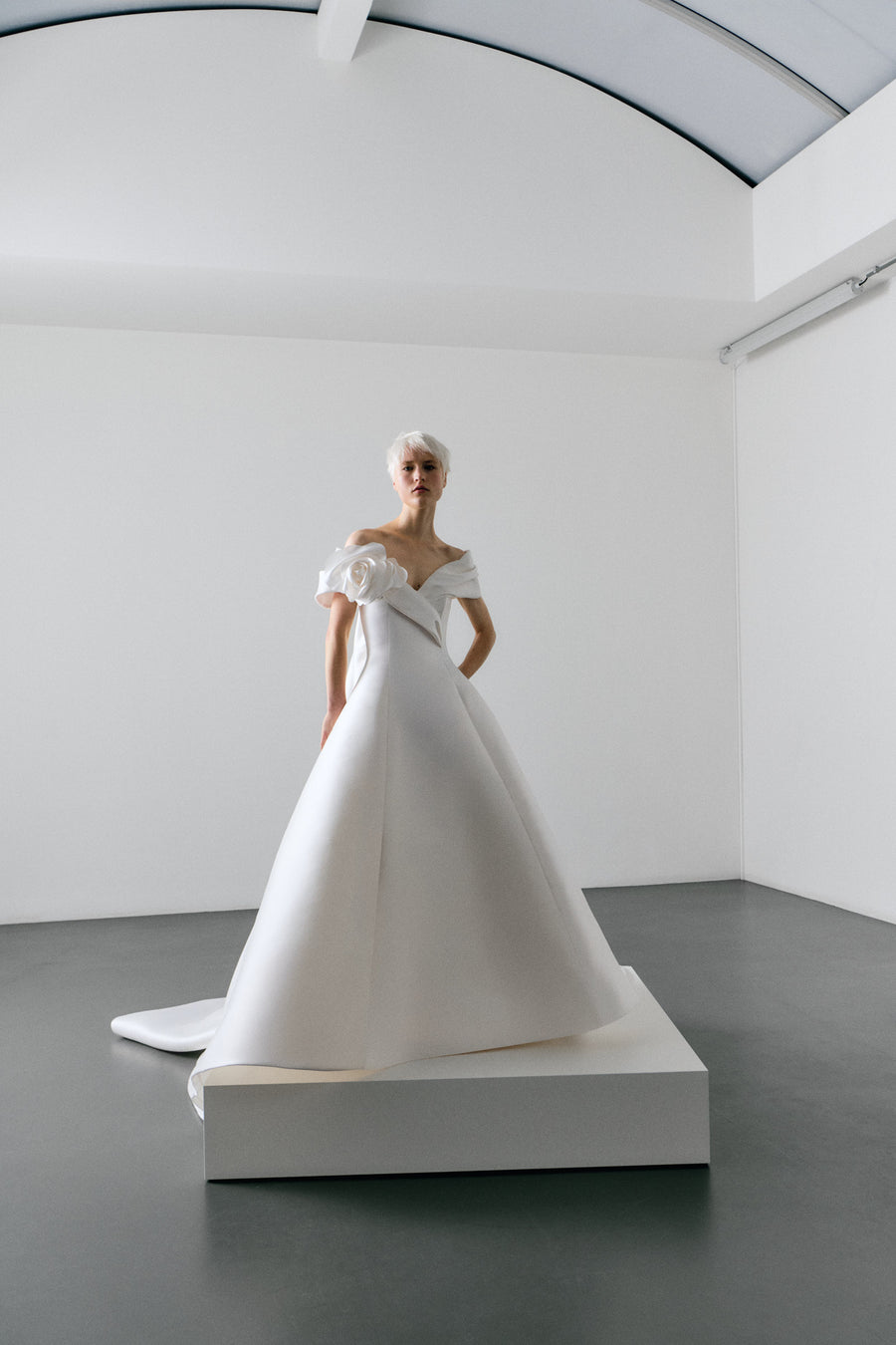 White wedding dress on a mannequin in a minimalistic setting