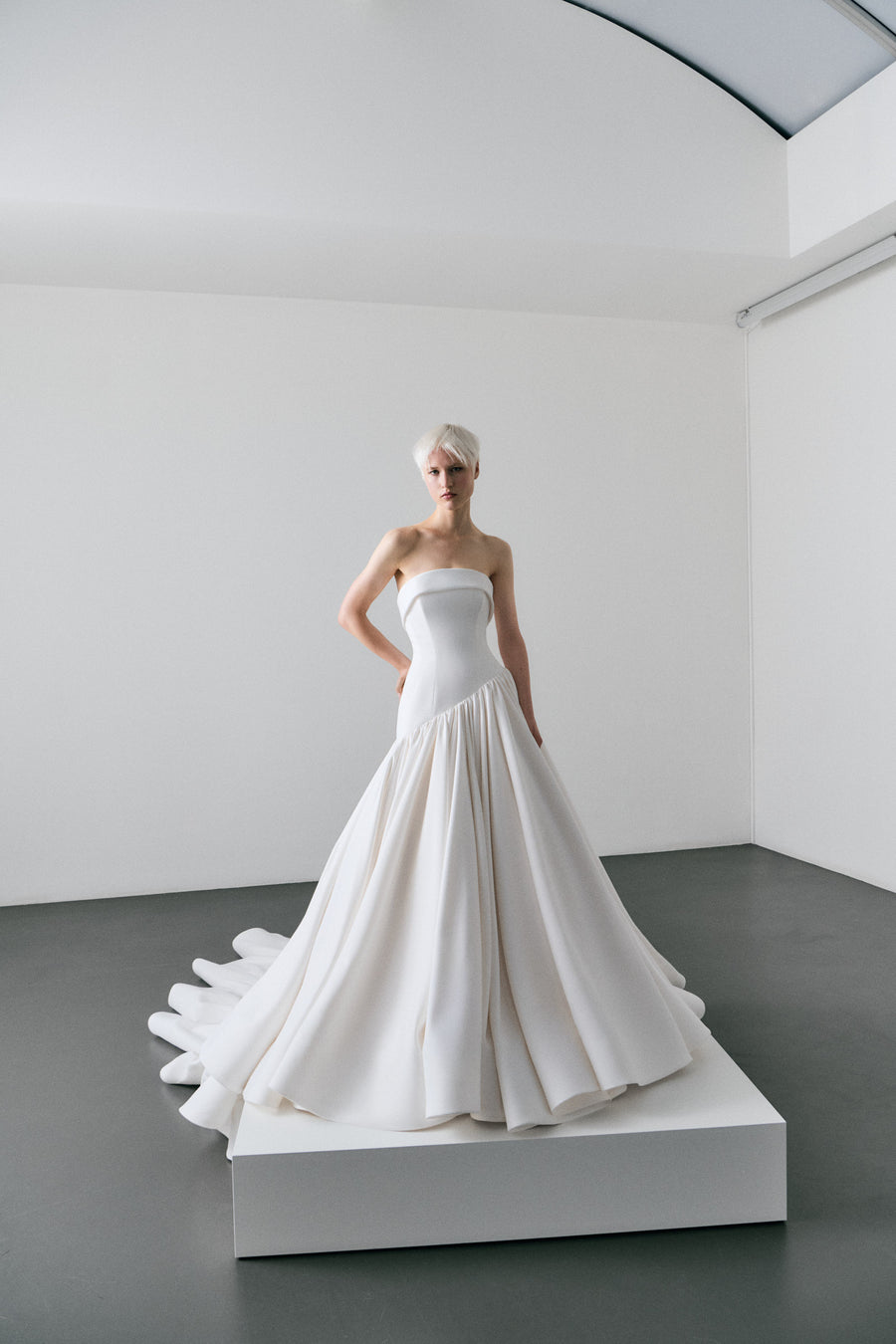 White wedding dress on a mannequin in a minimalistic setting