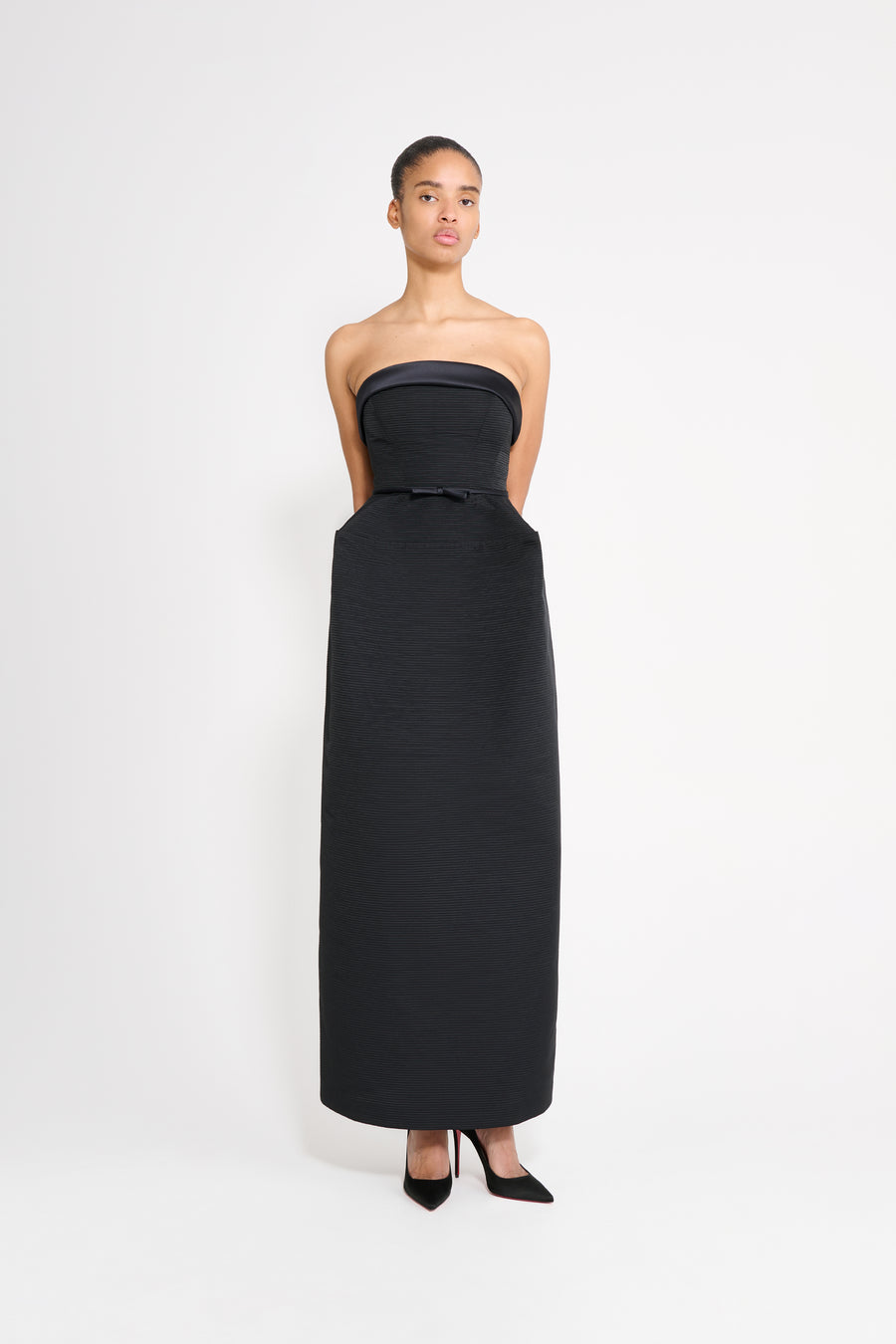 Model wearing a black cubist gown.