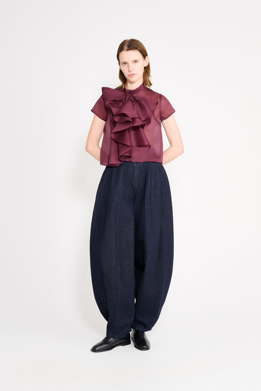 Model wearing a bow top in the "BERRY" color.