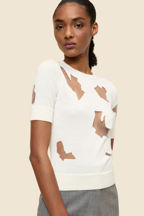 The laser cut hemlines and pleated japanese bonded satin embrace vitkor&rolf's scissorhands signature details in a dress