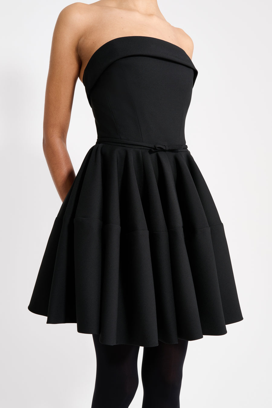 Black strapless dress on a white background