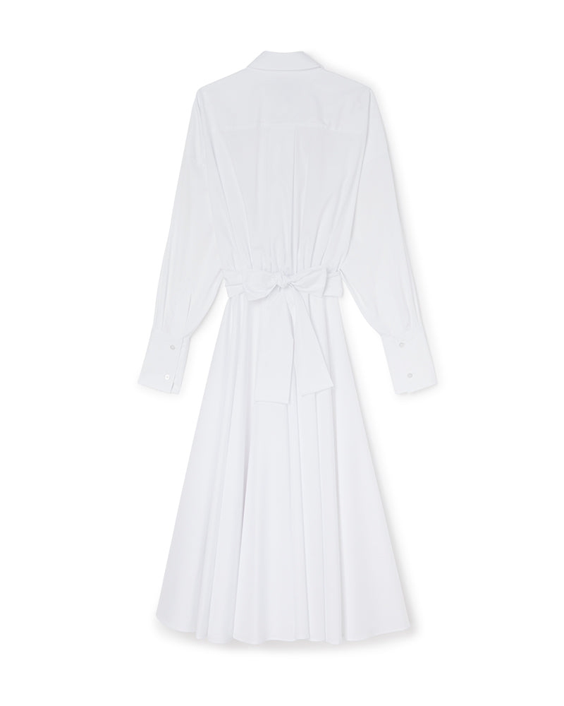 Elegant white cotton shirt dress with a back tie waist, buttoned cuffs, and flowing pleated skirt for a chic silhouette.