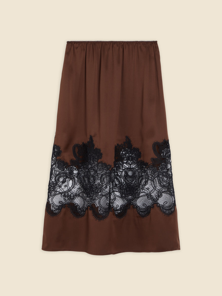 A brown satin skirt highlighted by intricate black lace embroidery along the hem, creating a sophisticated contrast.