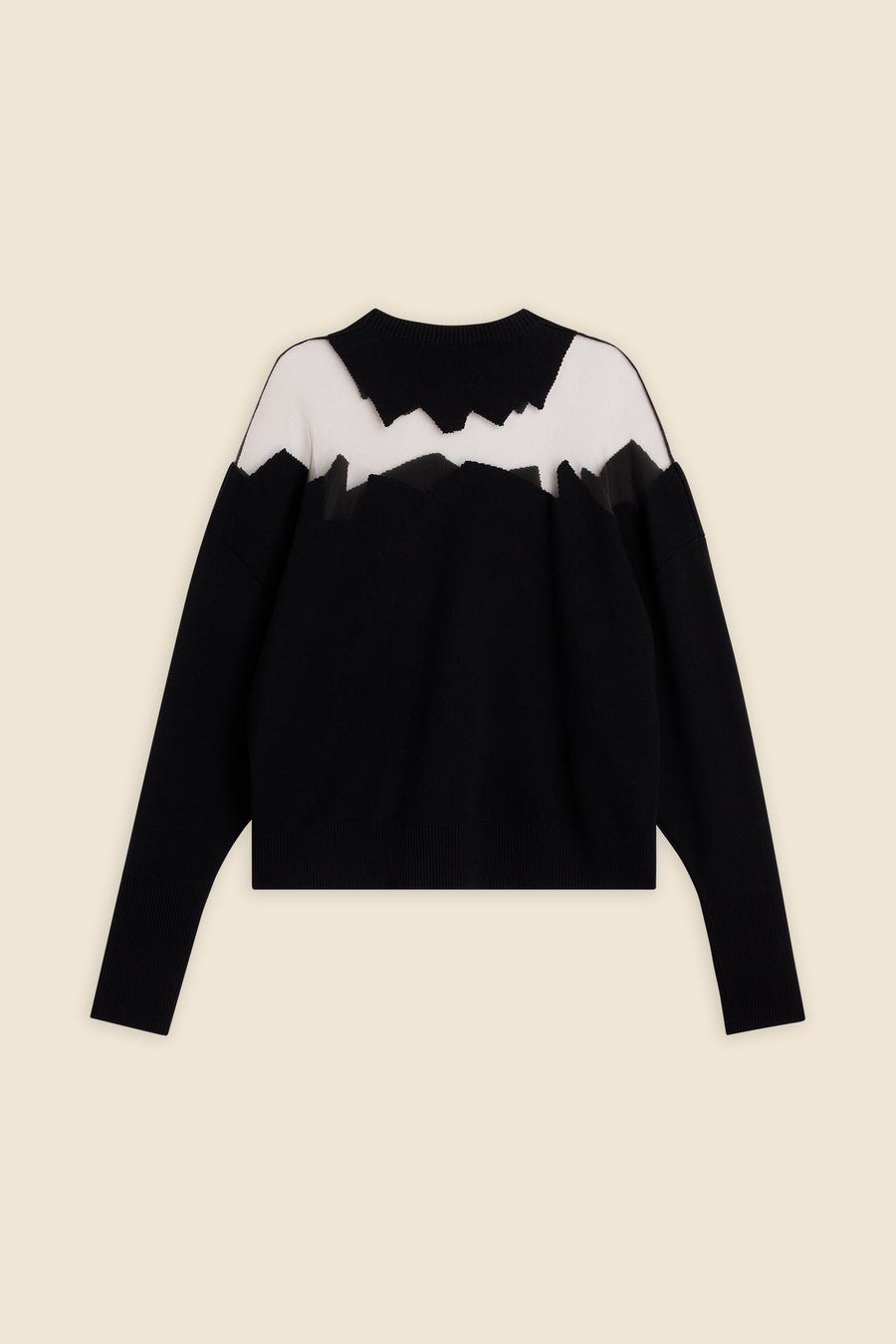 Knit sweater featuring abstract mountain design in black and white, with a round neck and long sleeves for a modern style.
