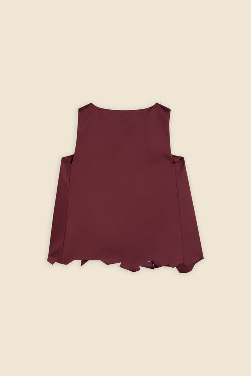 Sleeveless top in deep maroon with clean lines and an asymmetrical hem design set against a neutral background.