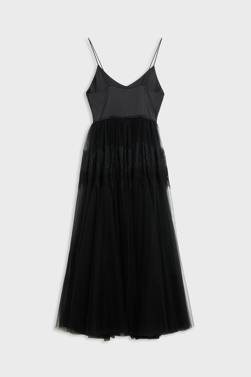 Black dress shot from the back with tulle and lace skirt. 
