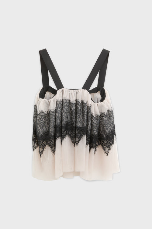 Top with lace and tulle and black strap shot from the back.