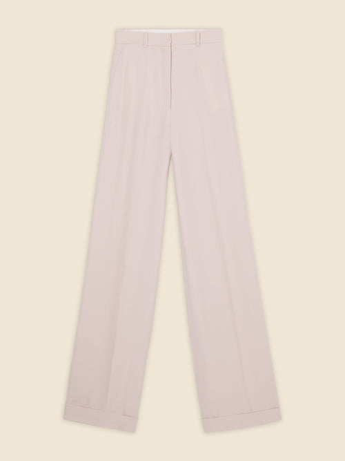 Wide-leg trousers in soft blush wool blend, featuring tailored pleats and a high-waist design with discreet belt loops.