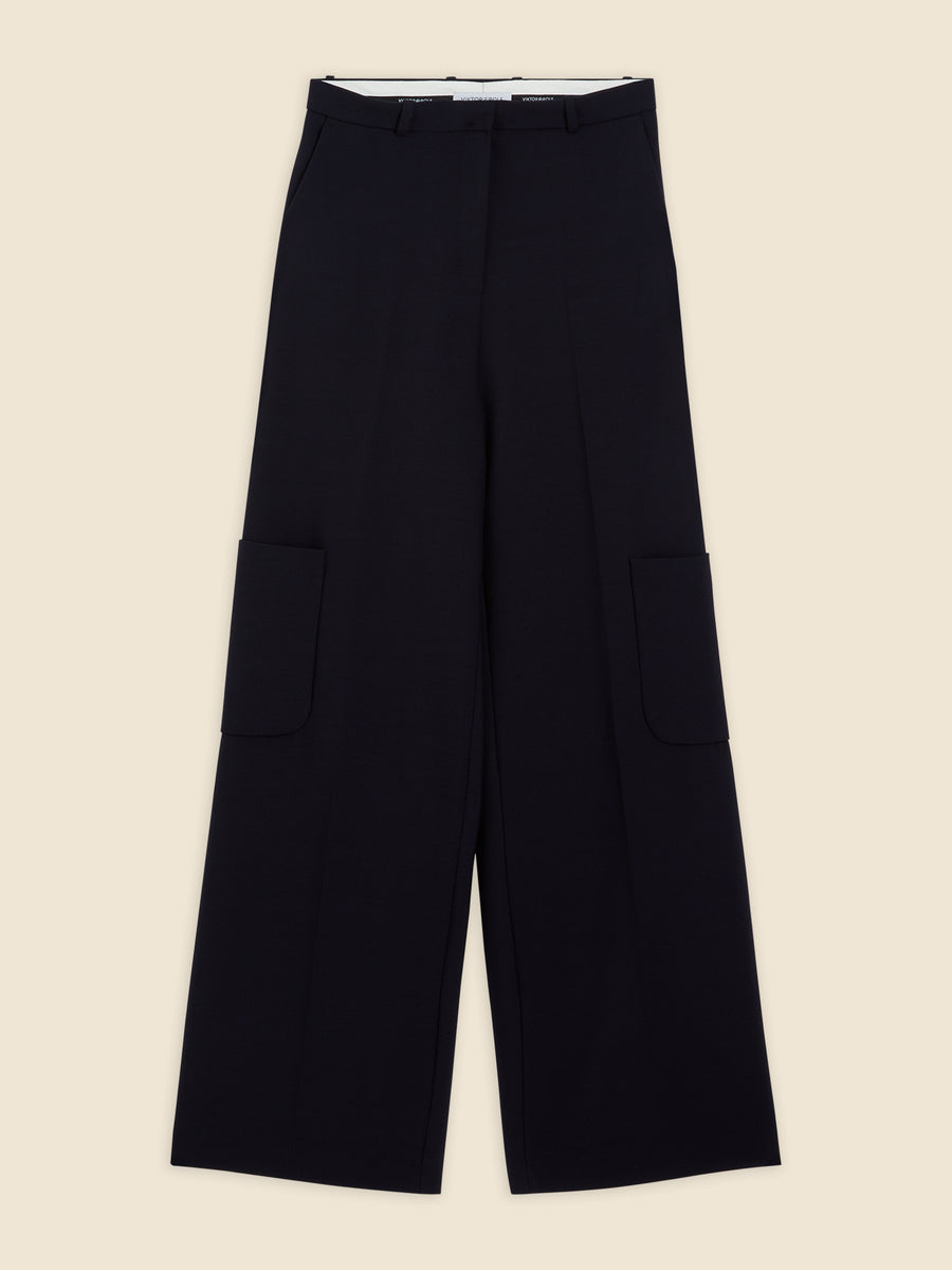 Wide-leg black trousers featuring large utility pockets, crafted from luxurious wool with a subtle crease along the front.