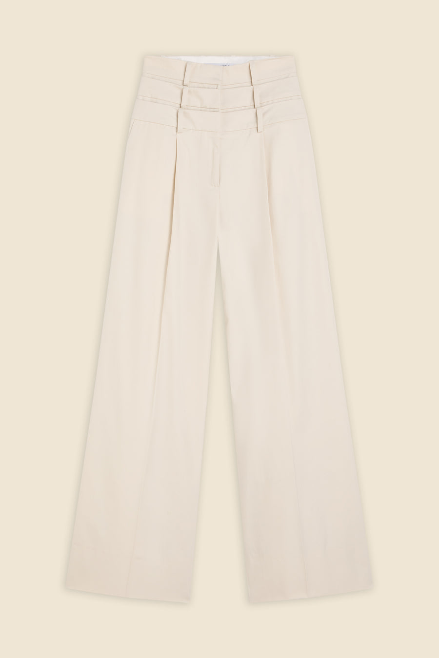 Beige multi-layer high waist trousers on a beige background.