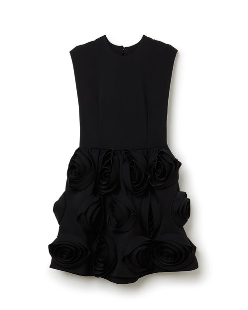 Sleeveless black dress featuring intricate 3D floral rosette embellishments on the skirt, crafted in elegant fabric.
