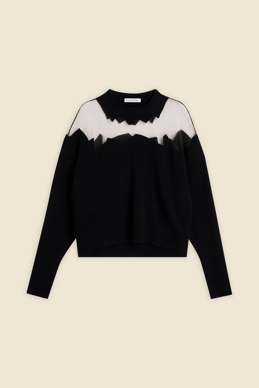 Black sweater with jagged white mesh neckline detail, featuring long sleeves and a relaxed fit on a neutral background.