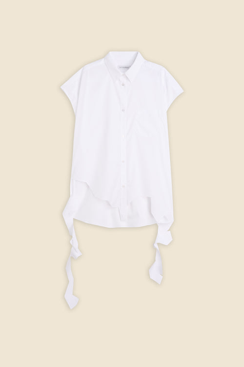 White short-sleeve button-up shirt with asymmetrical hem and decorative ties, set against a neutral background.