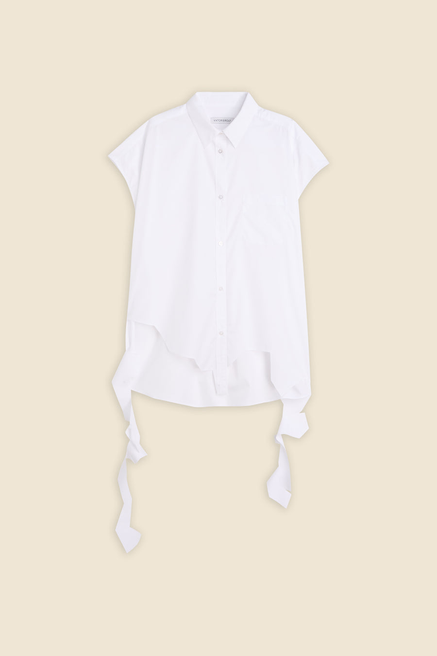 White short-sleeve button-up shirt with asymmetrical hem and decorative ties, set against a neutral background.