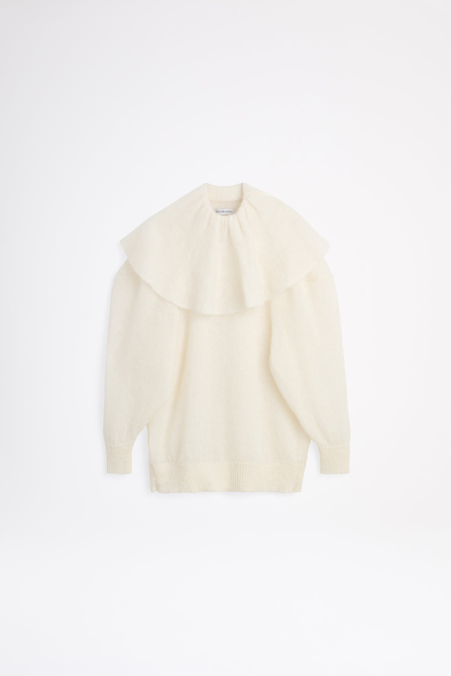 White volant neck sweater.