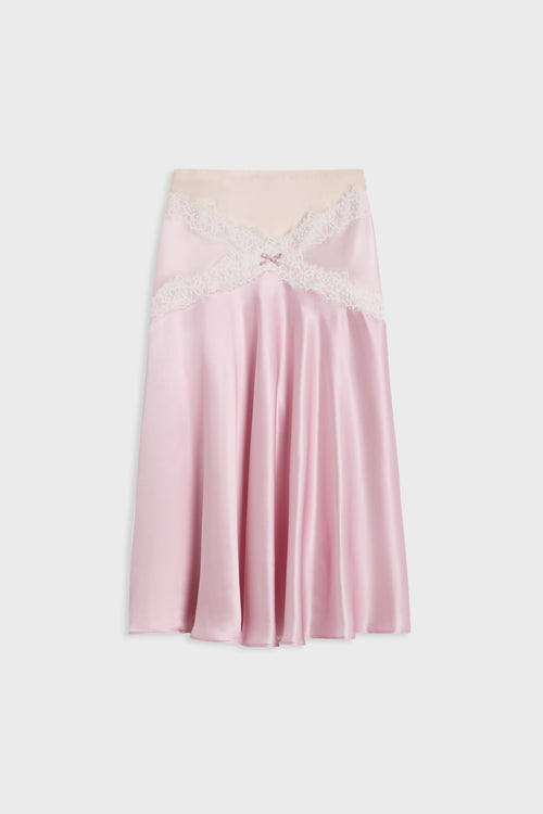 A light pink satin slip skirt with a beige lace-trimmed waistband and a small bow detail at the center front, displayed flat against a light gray background.