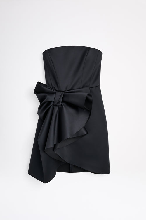 Mini black dress on a white background.