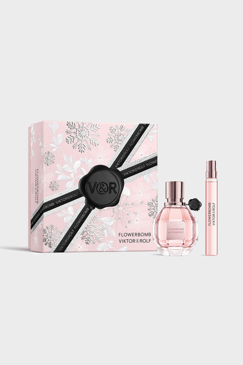 Elegant pink Flowerbomb gift set by Viktor & Rolf, featuring a faceted perfume bottle and sleek, floral-themed packaging for women.