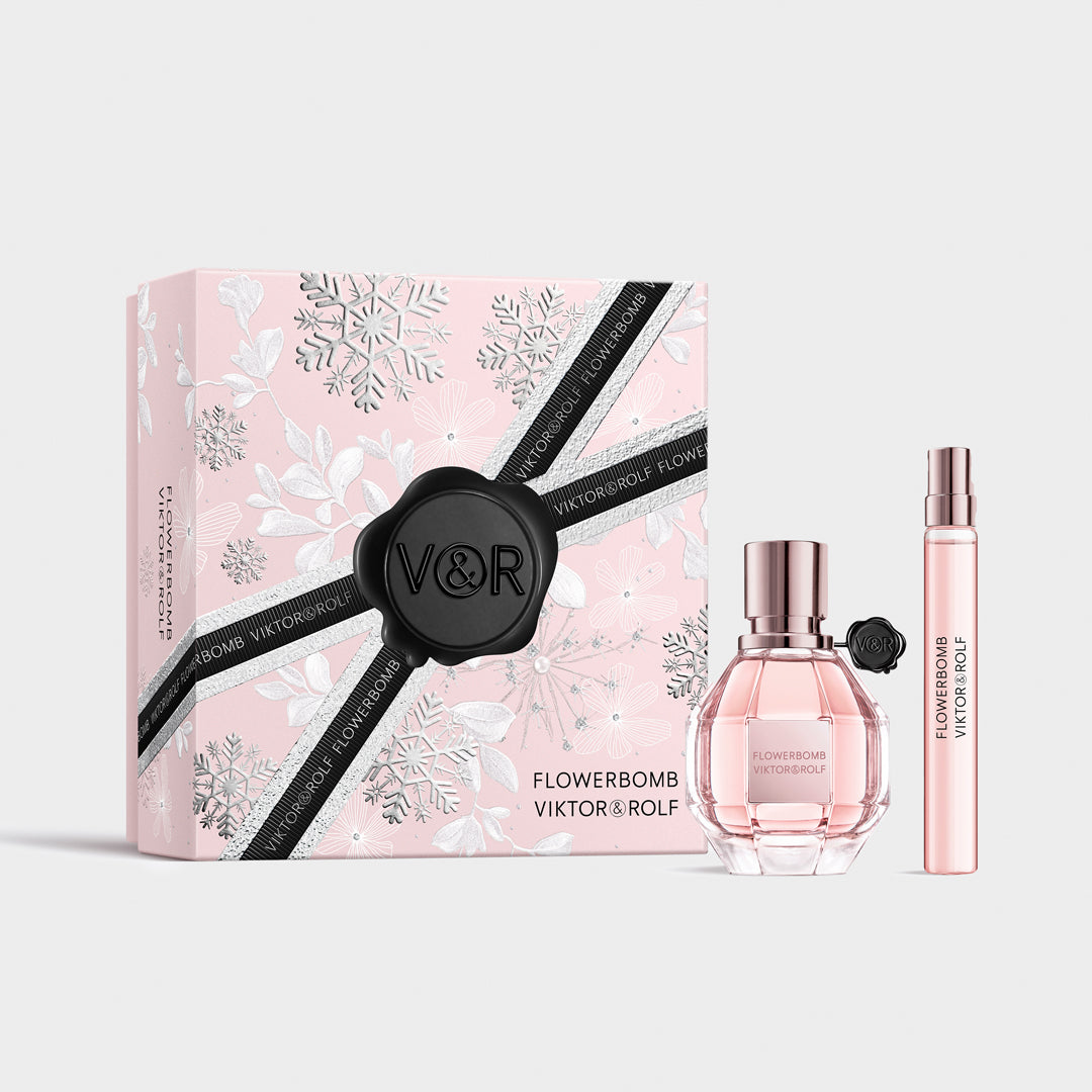 Elegant pink Flowerbomb gift set by Viktor & Rolf, featuring a faceted perfume bottle and sleek, floral-themed packaging for women.