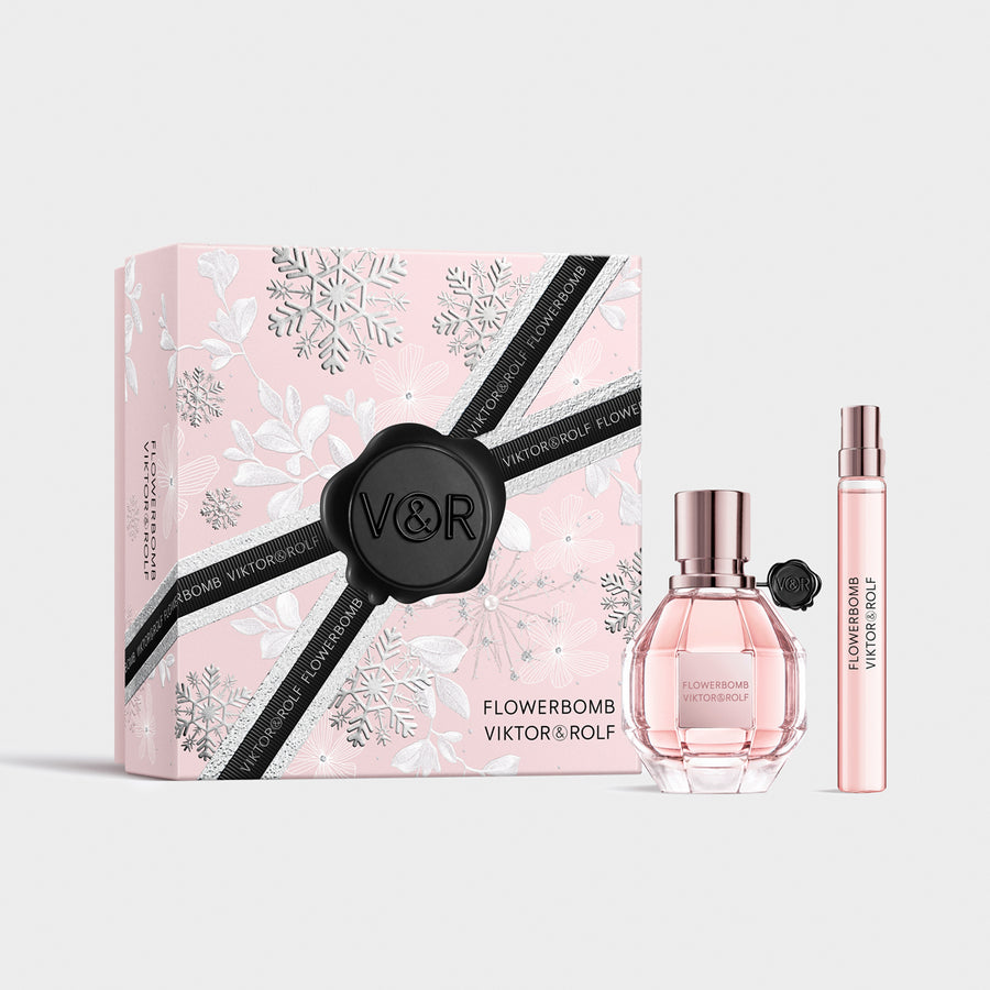 Elegant pink Flowerbomb gift set by Viktor & Rolf, featuring a faceted perfume bottle and sleek, floral-themed packaging for women.