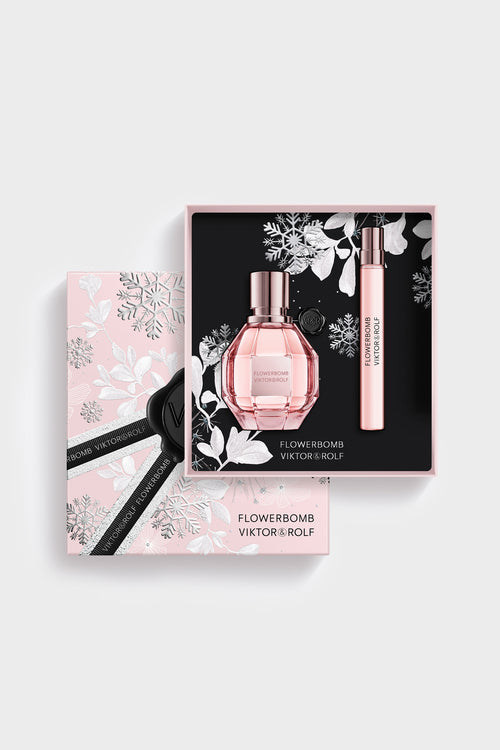 Elegant pink Flowerbomb gift set by Viktor & Rolf, featuring a faceted perfume bottle and sleek, floral-themed packaging for women.