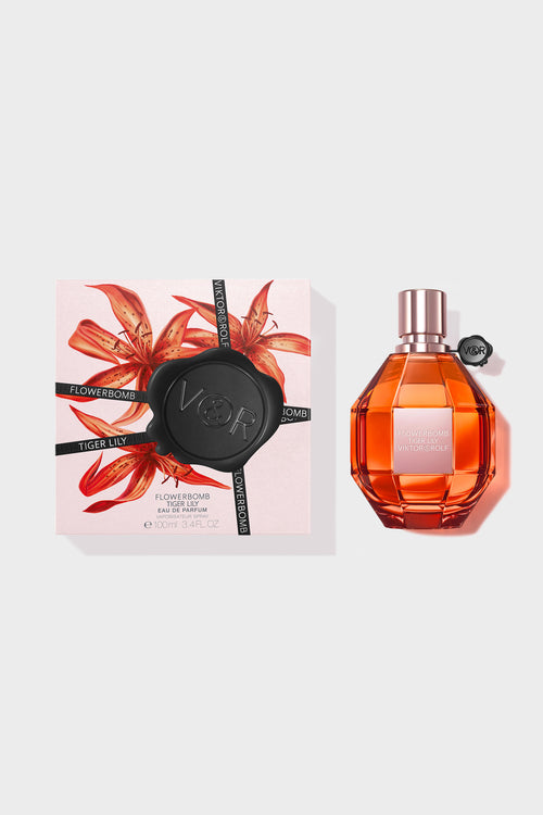 Tiger Lily Eau de Parfum by Viktor & Rolf, in amber tones, exuding a floral aroma for women.