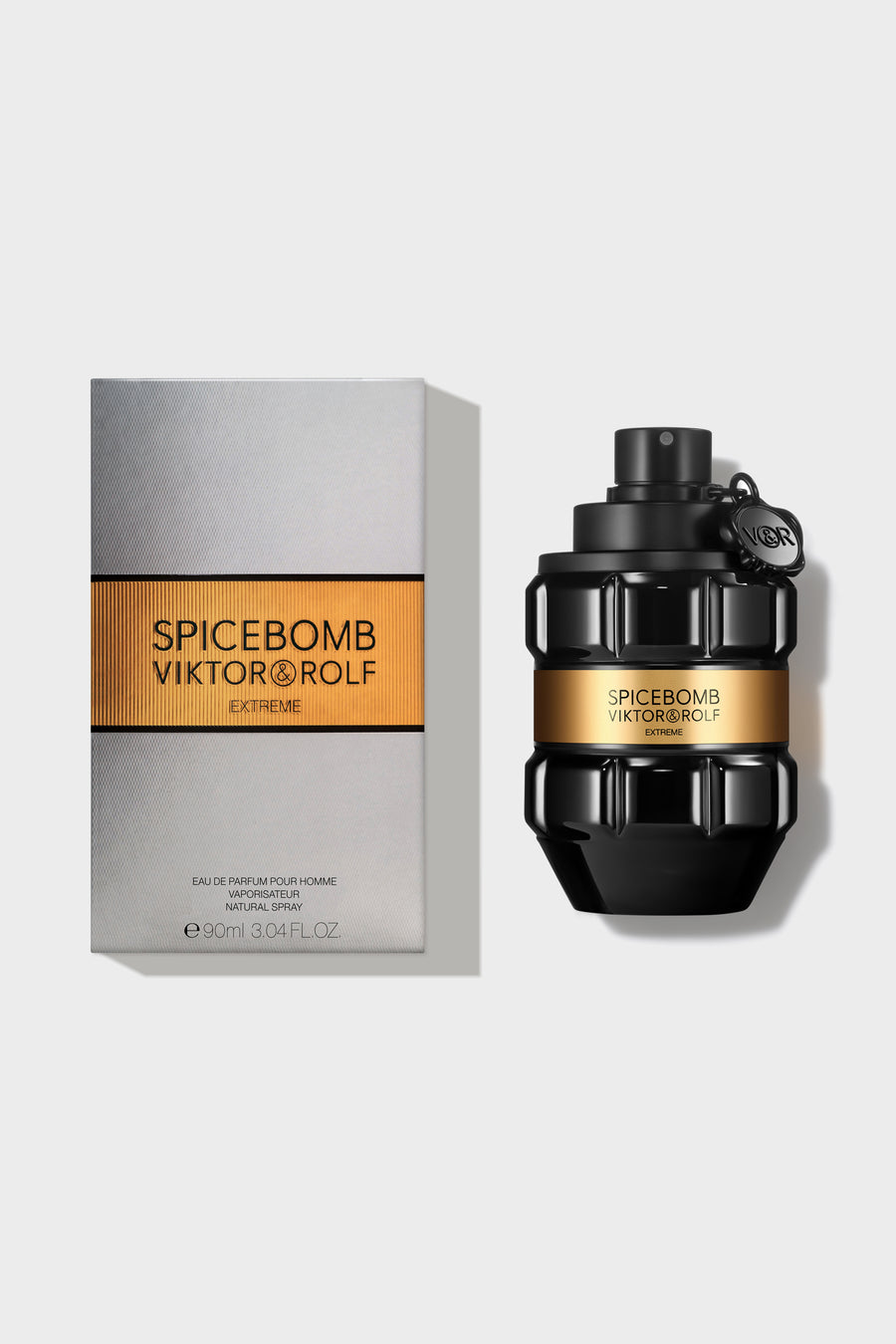 Grenade-shaped bottle of Spicebomb Extreme by Viktor & Rolf, a bold fragrance for men, with sleek black and gold design.