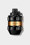 Black grenade-shaped perfume bottle with an amber label, featuring sculpted geometric facets, against a grey background.