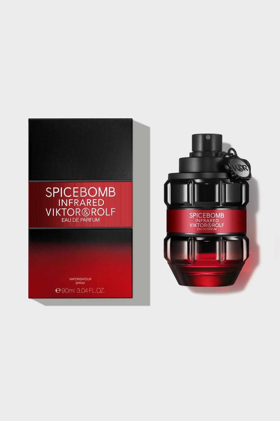 Grenade-shaped bottle of Spicebomb Infrared Eau de Parfum by Viktor & Rolf, sleek black and red design for men, exudes fiery spices.
