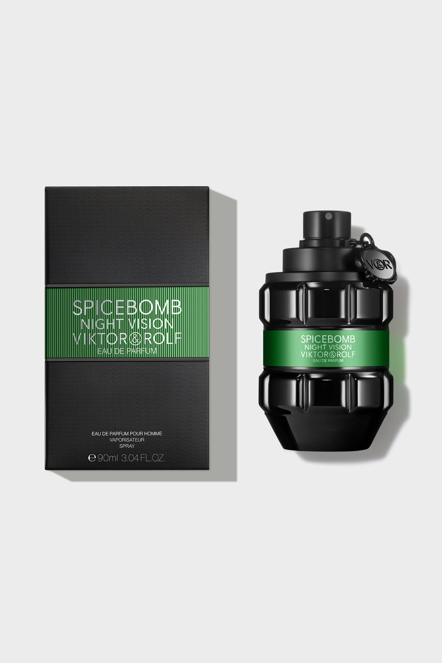 Bold grenade-shaped bottle of Spicebomb Eau de Parfum for men by Viktor & Rolf, with a sleek black and green design.