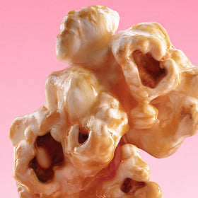 Close-up of caramel popcorn on a pink background