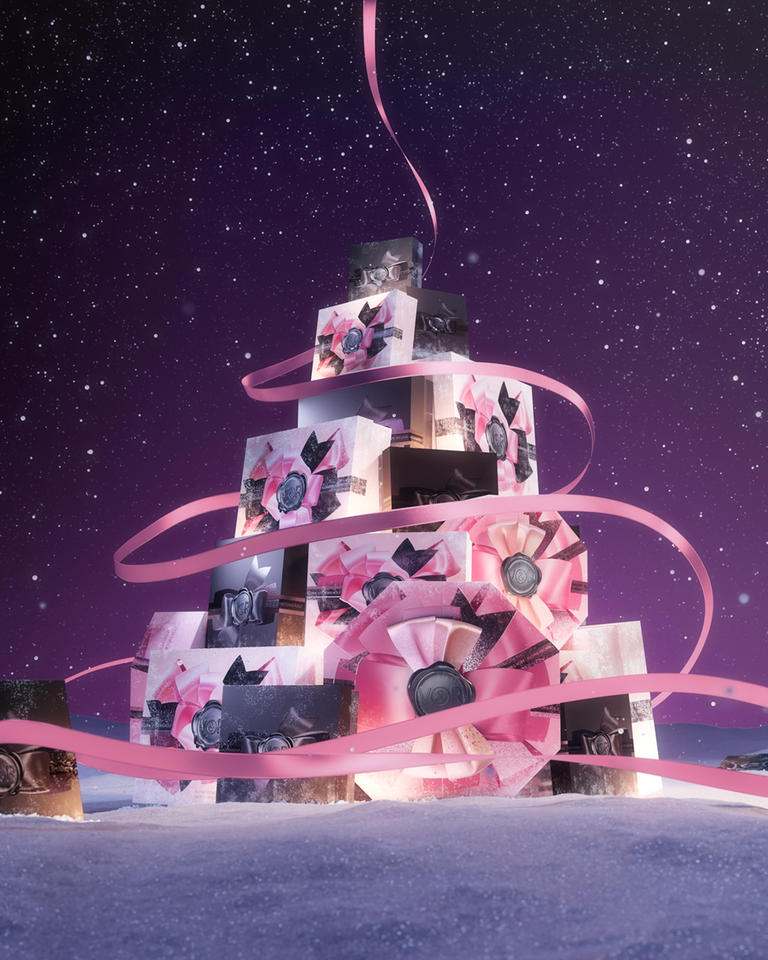 Viktor&Rolf perfumes stacked up in a christmas tree shape.